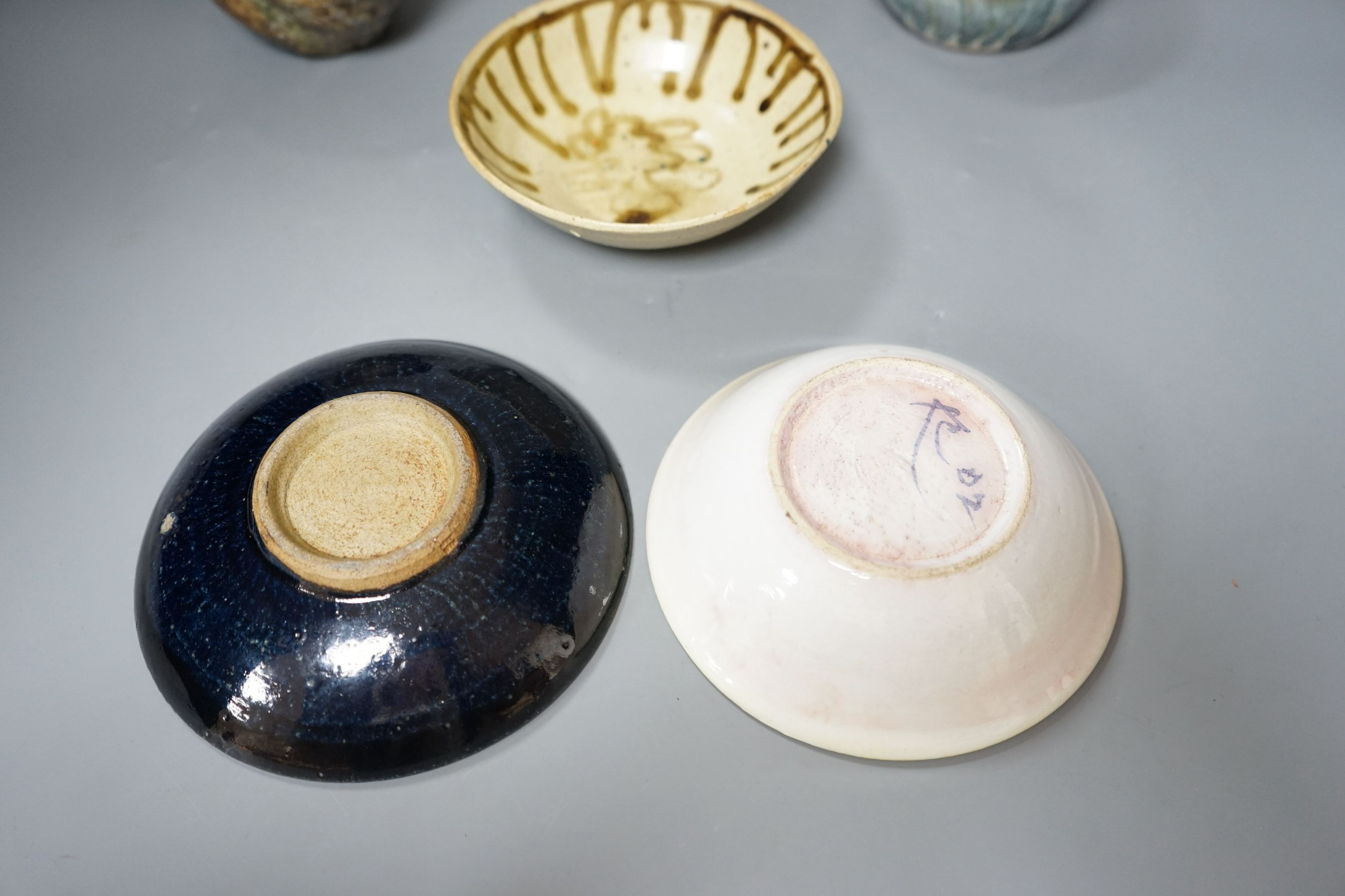 Studio pottery; a group of three bowls, a tenmoku dish, a small vase and a large cup, some marked, tallest 12cm, (6)